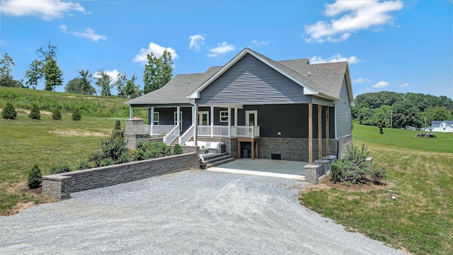 1268 S Tidwell Rd, Bon Aqua, TN 37025 - view of front of home featuring a porch and a front yard