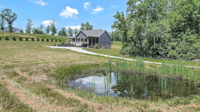 1268 S Tidwell Rd, Bon Aqua, TN 37025 - back of house featuring a yard and a water view