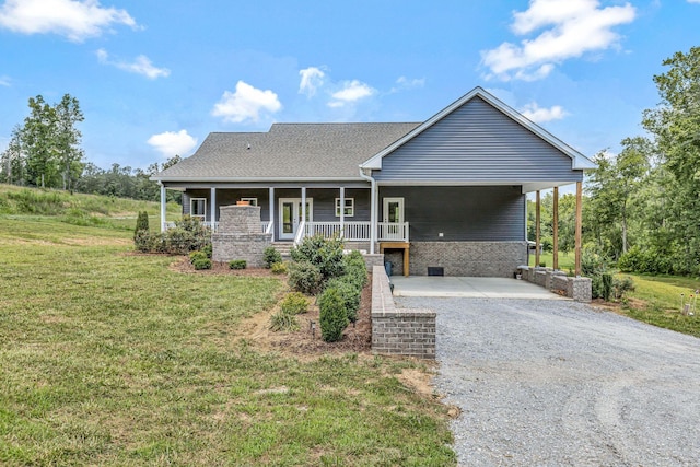 1268 S Tidwell Rd, Bon Aqua, TN 37025 - view of front facade with a front yard, gravel driveway, and covered porch