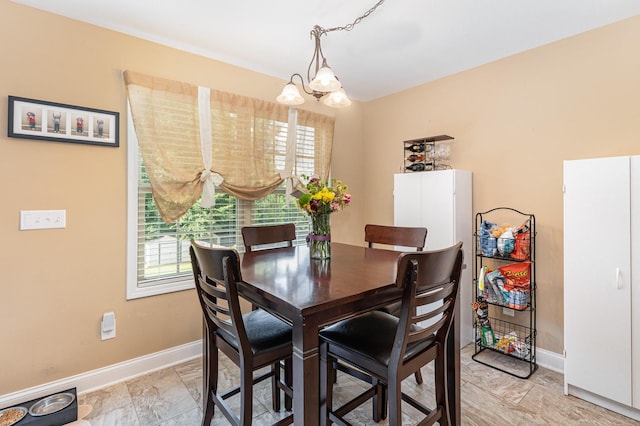 128 Thomas Traylor Ln, Clarksville, TN 37043 - dining room featuring a chandelier and baseboards