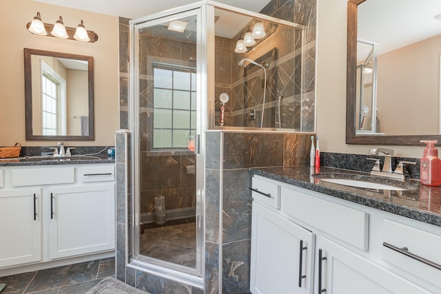 128 Thomas Traylor Ln, Clarksville, TN 37043 - bathroom featuring two vanities, a shower stall, and plenty of natural light