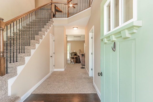 128 Thomas Traylor Ln, Clarksville, TN 37043 - foyer entrance featuring a towering ceiling, stairs, and wood finished floors