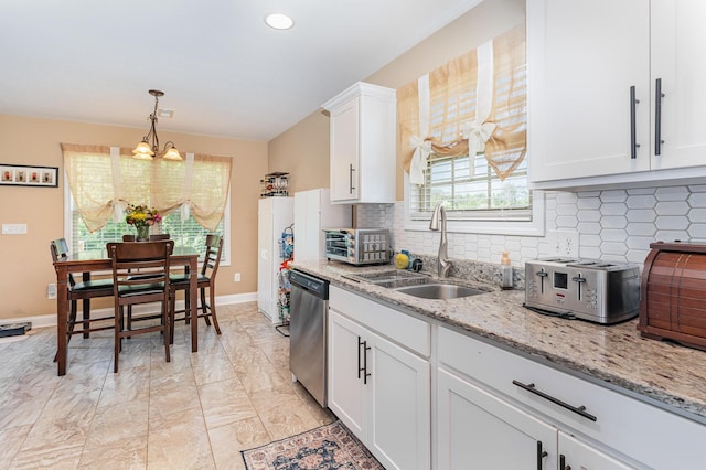 128 Thomas Traylor Ln, Clarksville, TN 37043 - kitchen with stainless steel dishwasher, a chandelier, decorative backsplash, white cabinets, and recessed lighting