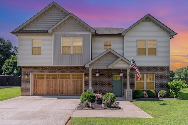 128 Thomas Traylor Ln, Clarksville, TN 37043 - view of front facade with brick siding, a garage, and driveway