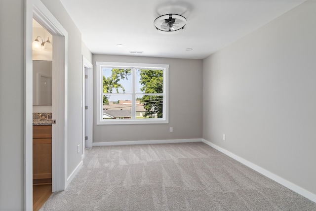 415 9th St, Clarksville, TN 37040 - spare room featuring light colored carpet and baseboards