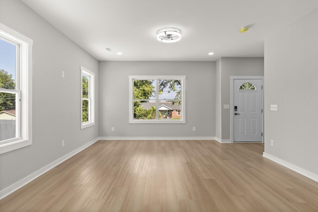 415 9th St, Clarksville, TN 37040 - unfurnished living room featuring light wood-type flooring and recessed lighting
