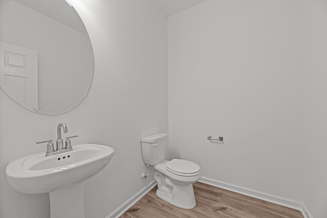 2900 Suzanne Landon Dr Unit E2, Murfreesboro, TN 37130 - half bathroom featuring a sink and wood finished floors