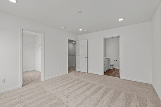 2900 Suzanne Landon Dr Unit E2, Murfreesboro, TN 37130 - unfurnished bedroom with carpet floors, a spacious closet, recessed lighting, ensuite bathroom, and a closet