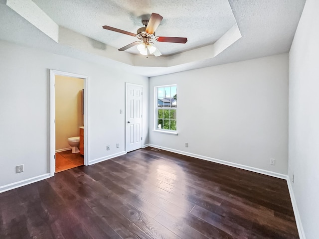 1333 Meredith Way, Clarksville, TN 37042 - unfurnished bedroom with a textured ceiling, wood finished floors, a raised ceiling, ensuite bath, and a ceiling fan