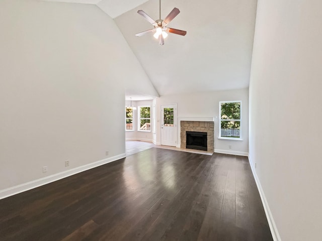 1333 Meredith Way, Clarksville, TN 37042 - unfurnished living room with high vaulted ceiling, dark wood-style flooring, a ceiling fan, and a stone fireplace