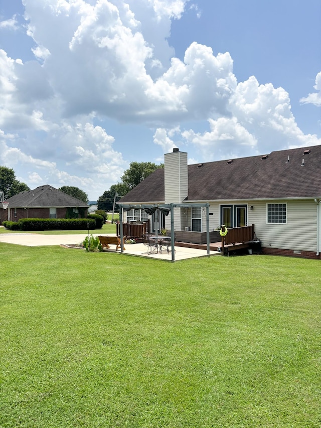 108 Easy St, Pulaski, TN 38478 - rear view of house featuring a yard, a chimney, a patio, and a wooden deck