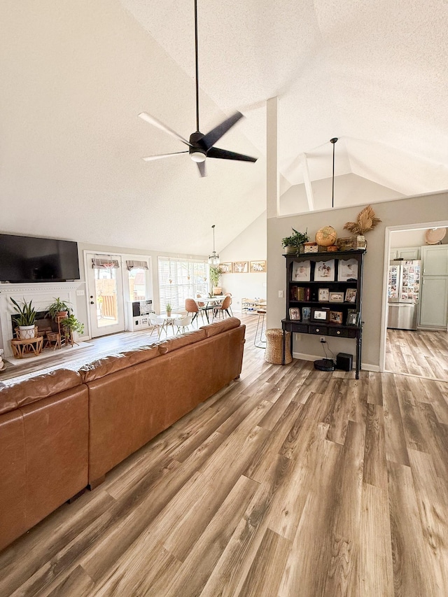 108 Easy St, Pulaski, TN 38478 - living room featuring lofted ceiling, ceiling fan, wood finished floors, and a textured ceiling