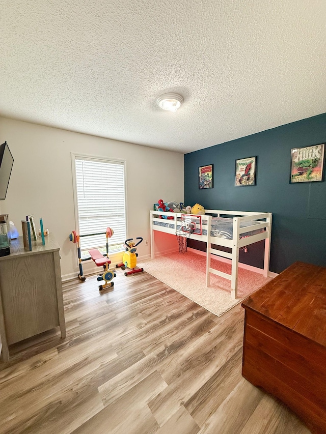 108 Easy St, Pulaski, TN 38478 - bedroom featuring wood finished floors and a textured ceiling