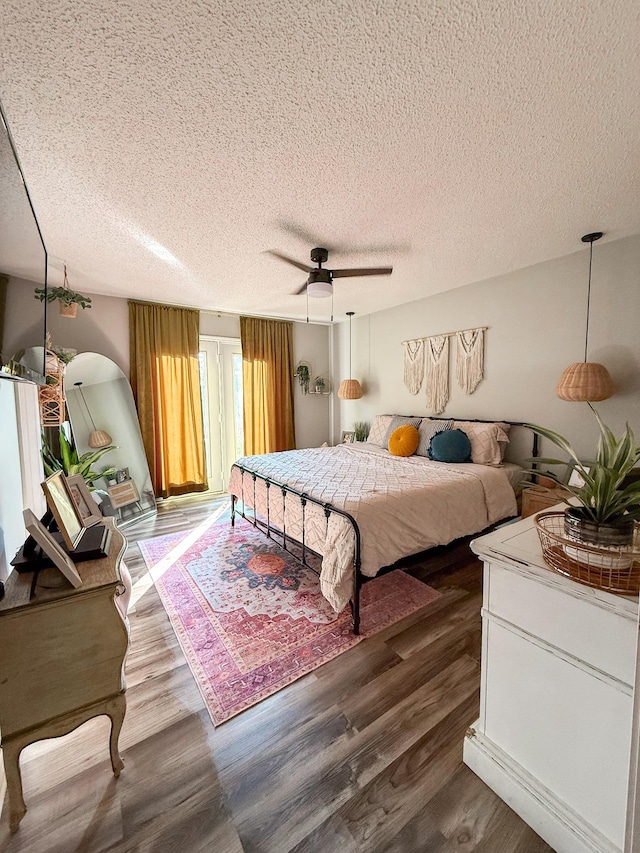108 Easy St, Pulaski, TN 38478 - bedroom with a textured ceiling, dark wood-style floors, and a ceiling fan