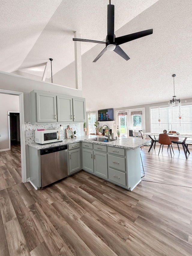 108 Easy St, Pulaski, TN 38478 - kitchen with dishwasher, white microwave, a textured ceiling, ceiling fan, and a peninsula