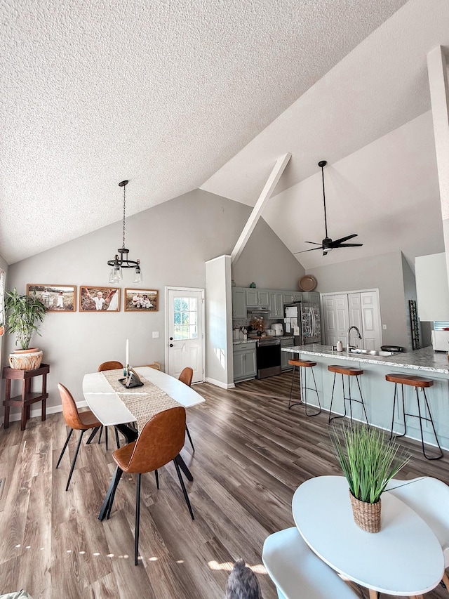 108 Easy St, Pulaski, TN 38478 - dining room with a textured ceiling, high vaulted ceiling, ceiling fan, wood finished floors, and a chandelier