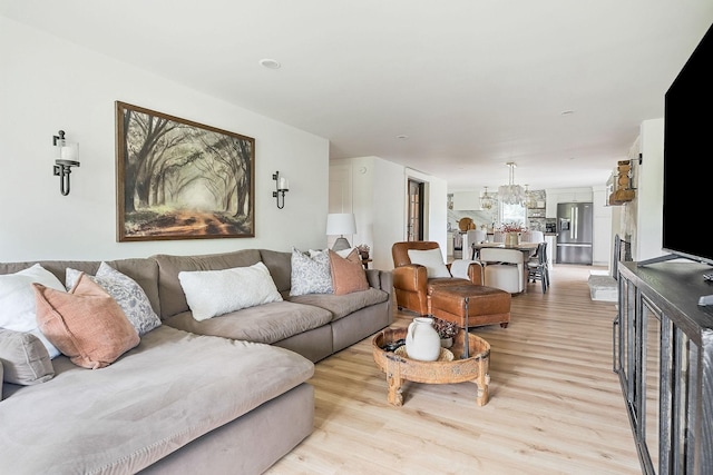 3510 Bybee Branch Rd, Mcminnville, TN 37110 - living room featuring light wood-type flooring and a chandelier