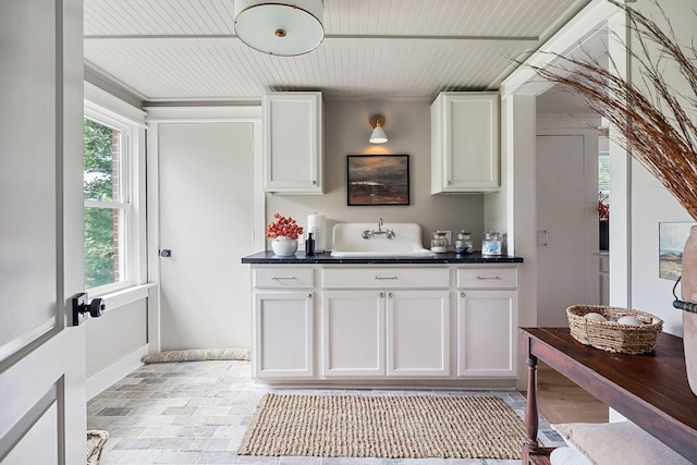 3510 Bybee Branch Rd, Mcminnville, TN 37110 - kitchen with dark countertops, healthy amount of natural light, white cabinets, and wood ceiling