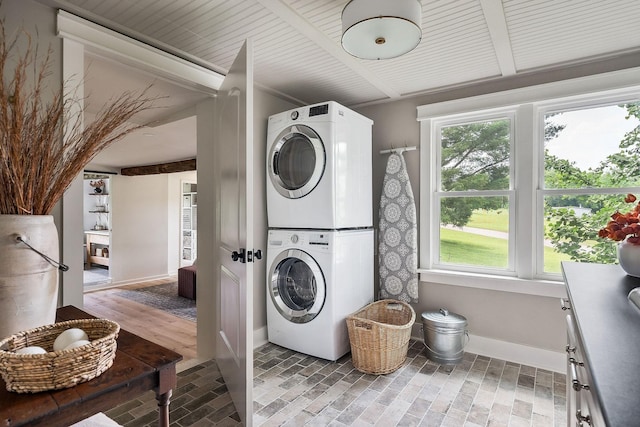 3510 Bybee Branch Rd, Mcminnville, TN 37110 - laundry area featuring stacked washing machine and dryer and baseboards