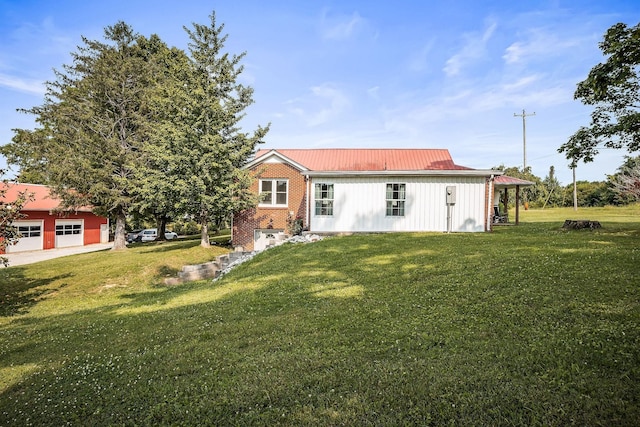 3510 Bybee Branch Rd, Mcminnville, TN 37110 - rear view of property with a yard, brick siding, and a metal roof