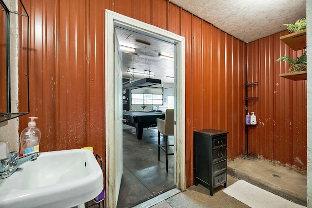 3510 Bybee Branch Rd, Mcminnville, TN 37110 - bathroom with wood walls and concrete floors