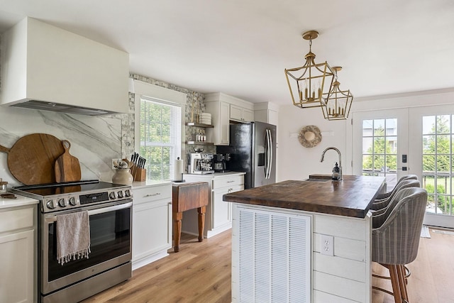 3510 Bybee Branch Rd, Mcminnville, TN 37110 - kitchen featuring stainless steel electric range, refrigerator with ice dispenser, custom range hood, wood counters, and backsplash
