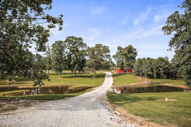 3510 Bybee Branch Rd, Mcminnville, TN 37110 - view of community featuring a yard, a water view, and driveway