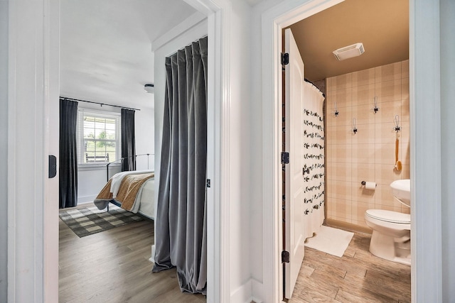 3510 Bybee Branch Rd, Mcminnville, TN 37110 - bathroom featuring wood finished floors and a shower with shower curtain