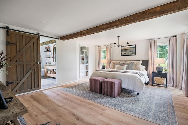 3510 Bybee Branch Rd, Mcminnville, TN 37110 - bedroom with light wood finished floors, beam ceiling, a barn door, and a chandelier