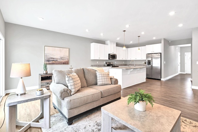 258 Dartmoor Pl, Goodlettsville, TN 37072 - living room with dark wood finished floors and recessed lighting