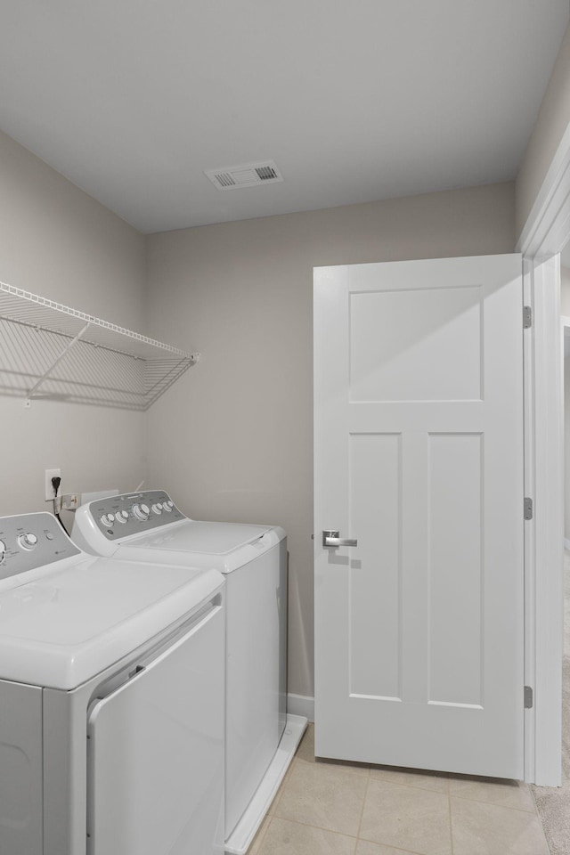 258 Dartmoor Pl, Goodlettsville, TN 37072 - laundry room with washer and dryer and light tile patterned floors