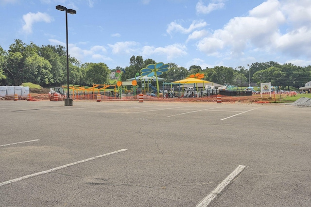 258 Dartmoor Pl, Goodlettsville, TN 37072 - uncovered parking lot with view of scattered trees