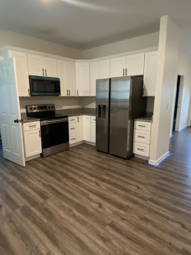 313 Hobbs Ave, Lebanon, TN 37087 - kitchen featuring appliances with stainless steel finishes, dark wood-style floors, and white cabinetry
