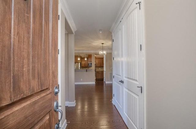 991 Westhaven Blvd Unit 32, Franklin, TN 37064 - hall with dark wood-type flooring, a chandelier, and ornamental molding