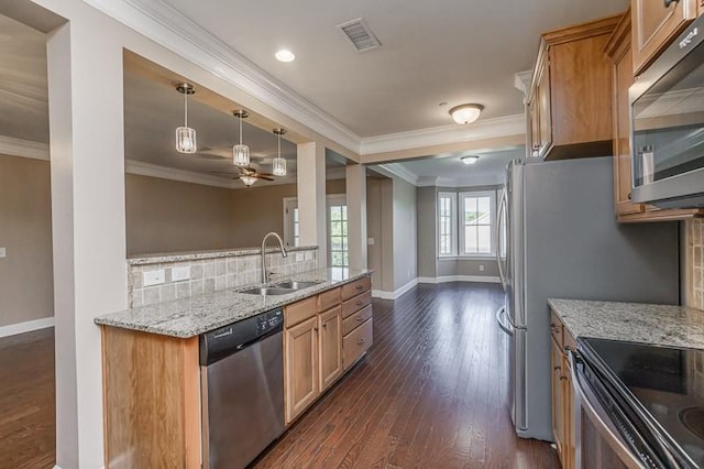 991 Westhaven Blvd Unit 32, Franklin, TN 37064 - kitchen with appliances with stainless steel finishes, crown molding, tasteful backsplash, light stone counters, and ceiling fan