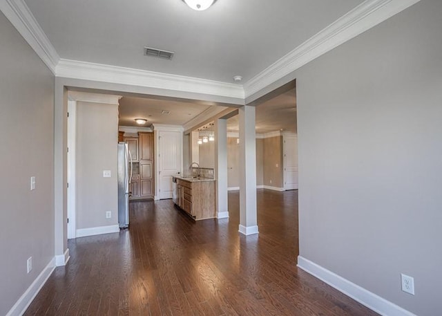 991 Westhaven Blvd Unit 32, Franklin, TN 37064 - unfurnished living room with crown molding and dark wood finished floors