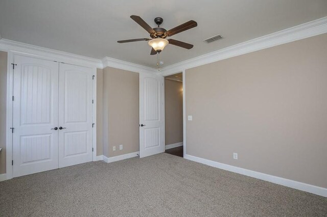 991 Westhaven Blvd Unit 32, Franklin, TN 37064 - unfurnished bedroom with crown molding, a closet, carpet floors, and ceiling fan