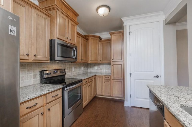 991 Westhaven Blvd Unit 32, Franklin, TN 37064 - kitchen featuring stainless steel appliances, crown molding, dark wood-type flooring, decorative backsplash, and light stone counters