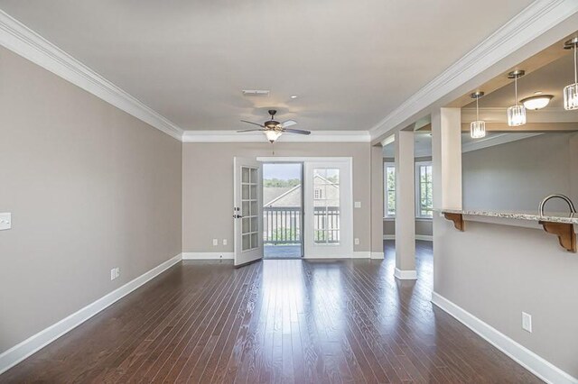 991 Westhaven Blvd Unit 32, Franklin, TN 37064 - empty room featuring dark wood-style floors, a ceiling fan, and crown molding