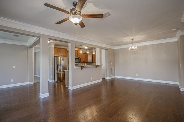 991 Westhaven Blvd Unit 32, Franklin, TN 37064 - unfurnished living room with a ceiling fan, a chandelier, dark wood finished floors, and crown molding