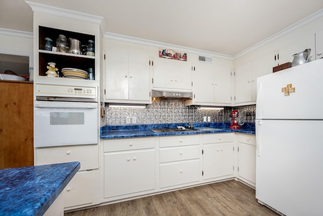 540 Powell Hollow Rd, Tullahoma, TN 37388 - kitchen featuring white appliances, dark countertops, white cabinetry, decorative backsplash, and crown molding