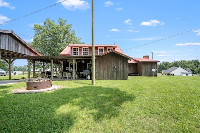 540 Powell Hollow Rd, Tullahoma, TN 37388 - back of house featuring a yard, a metal roof, and a chimney