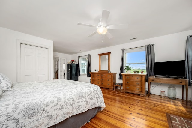 540 Powell Hollow Rd, Tullahoma, TN 37388 - bedroom featuring light wood finished floors, multiple windows, a closet, and ceiling fan