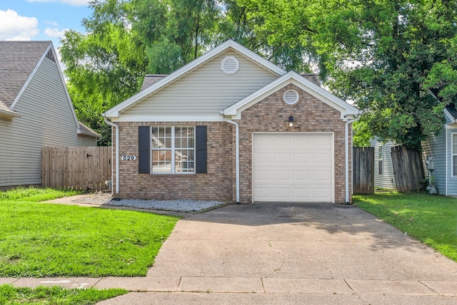 529 Southwind Dr, Hopkinsville, KY 42240 - view of front of house with a garage, brick siding, and concrete driveway