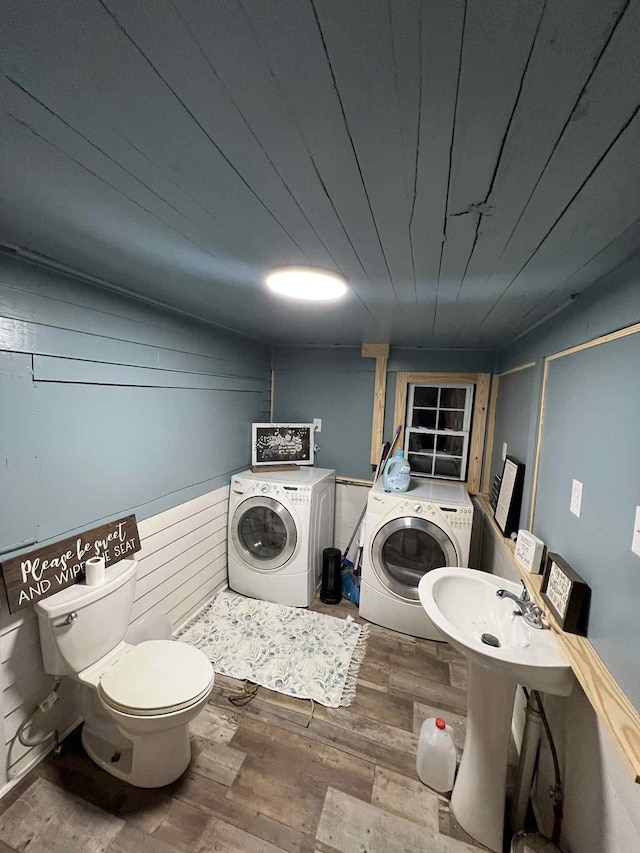 2016 Tennessee St, Westpoint, TN 38486 - bathroom with washing machine and clothes dryer and wood finished floors