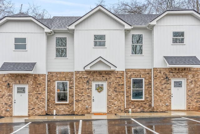 914 Power St Unit 12, Clarksville, TN 37042 - multi unit property with uncovered parking, a shingled roof, brick siding, and board and batten siding