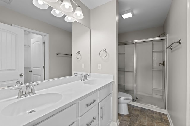 5538 Hamilton Cir, Antioch, TN 37013 - bathroom with a stall shower, double vanity, and stone finish floors