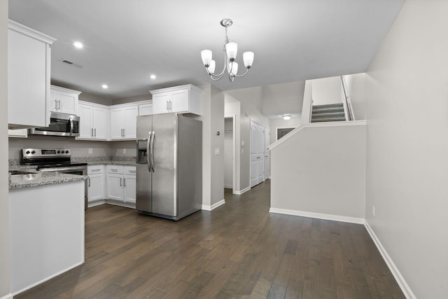 5538 Hamilton Cir, Antioch, TN 37013 - kitchen with appliances with stainless steel finishes, dark wood-type flooring, white cabinetry, and recessed lighting