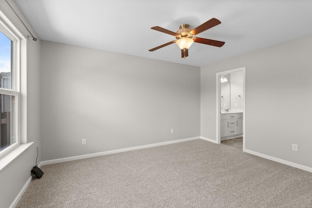 5538 Hamilton Cir, Antioch, TN 37013 - unfurnished bedroom featuring light colored carpet, a ceiling fan, and ensuite bath