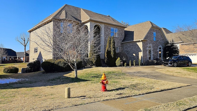 1413 Station Four Ln, Old Hickory, TN 37138 - french provincial home featuring brick siding, a front yard, and driveway
